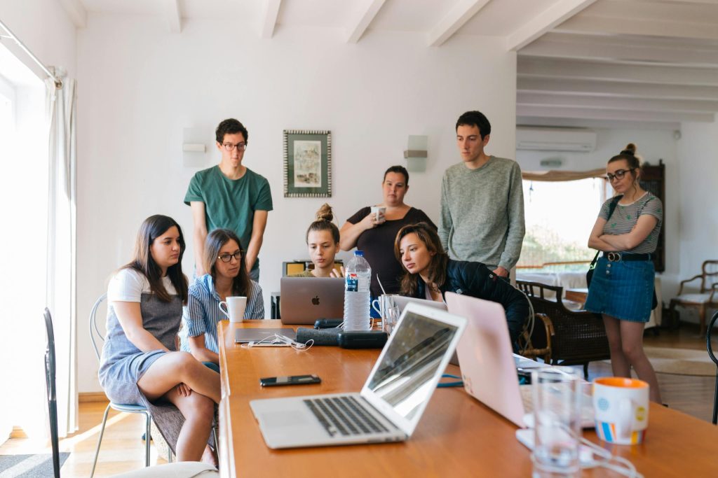 Group of people discussing bookkeeping reports