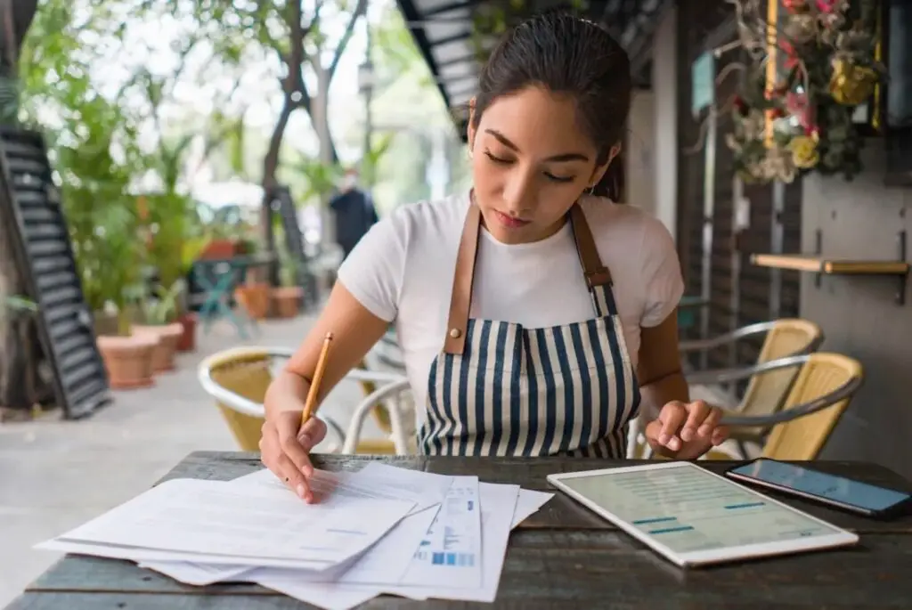 Small business owner reviewing financial information