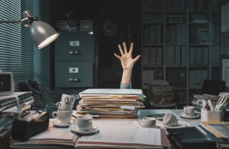 Person raising hand for help with their bookkeeping